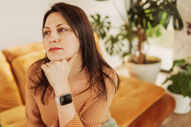 istock Calm Woman Relaxing on a Cozy Sofa at Home 2204918448