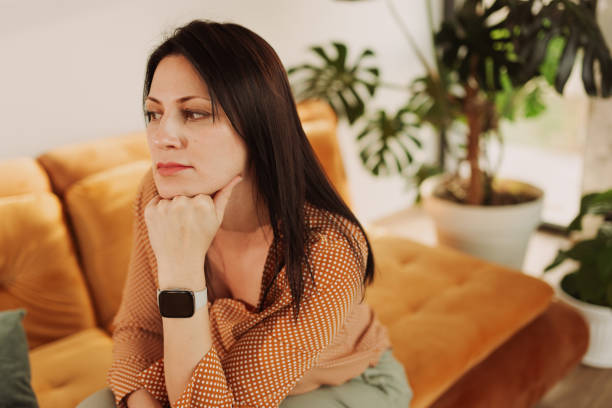 istock Woman Relaxing on a Cozy Sofa at Home 2204918453