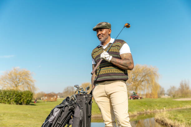 istock Two handsome senior mixed race golfer men enjoying a day of activity on a public golf course in the Netherlands 2204918461