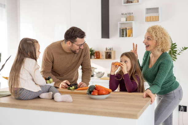 istock Happy Family Engaging in Playful Cooking Activity Together 2204919870