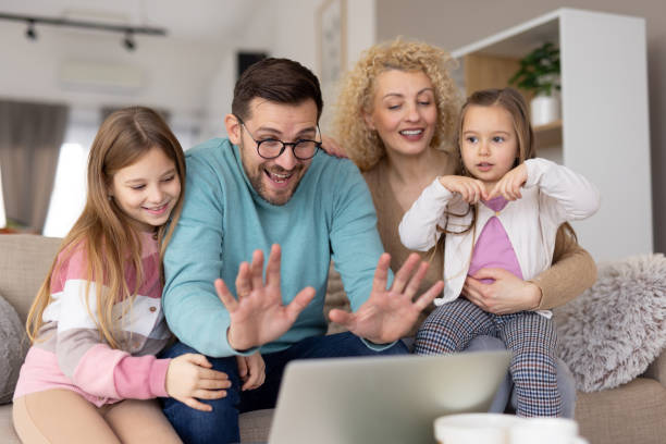 istock Celebrating Together: Family Sharing Joy on a Laptop 2204919894