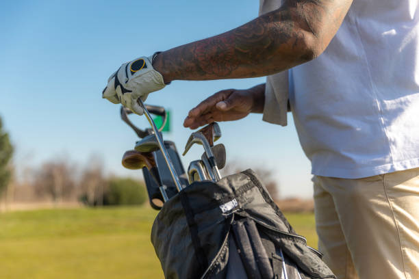 istock Unknown black golfer man enjoying a day of activity on a public golf course in the Netherlands 2204920835