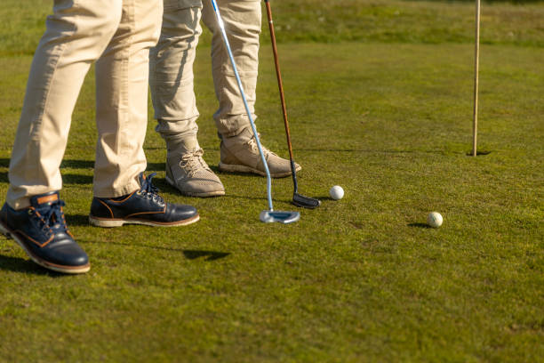 istock Two unknown senior mixed race golfer men enjoying a day of activity on a public golf course in the Netherlands 2204920886