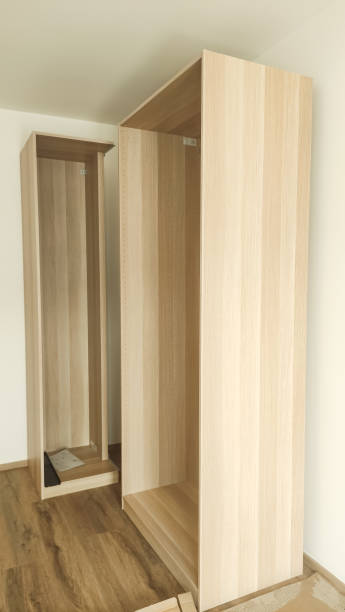 istock Assembling wooden wardrobe in modern apartment in prague 2204925017