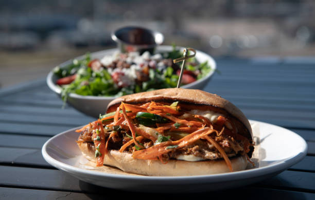 istock Pork Sandwich with Nuts and Berry Salad Combo 2204925547