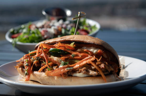 istock Pork Sandwich with Nuts and Berry Salad Together 2204925573