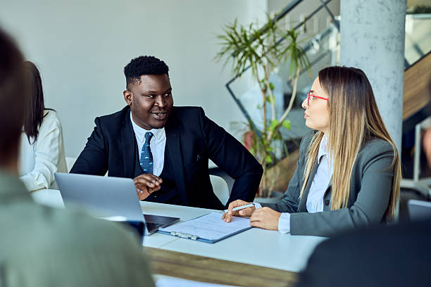 istock Professional Colleagues Discussing Work During a Team Meeting in Modern Office 2204928745