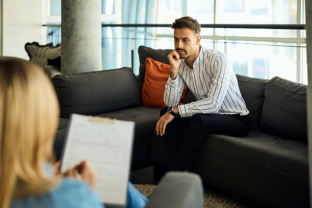 istock Man Engaged in Professional Counseling Session at Office Setting 2204931383