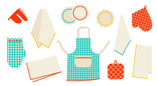 Set of different kitchen textiles. Apron, oven mitts, napkins and other on white background.