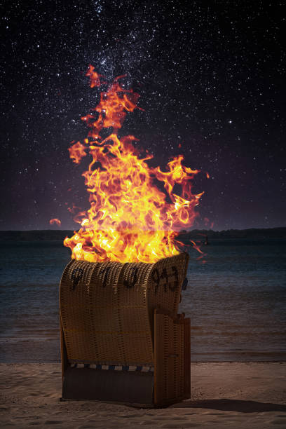 An outdoor chair is burning stock photo