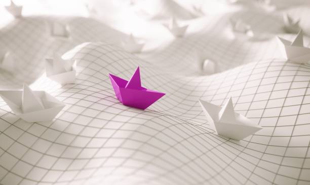 istock Individuality concept with paper boats 2204937025