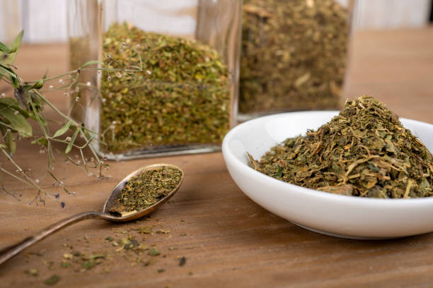 istock Herbal tea or dried herbs or medicine in jars with spoon 2204942076