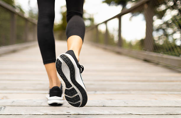 istock Woman walking exercising outdoors. 2204942577