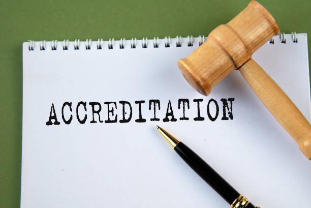 istock ACCREDITATION - word on a white sheet with a judge's gavel 2204943818