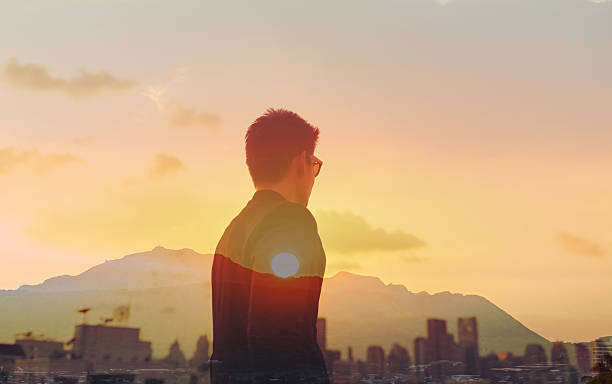 istock Businessman looking into city. Great new ideas. 2204943878