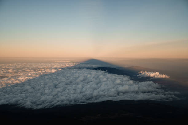istock Majestic mount meru casting long shadow over african savanna at sunset 2204943941