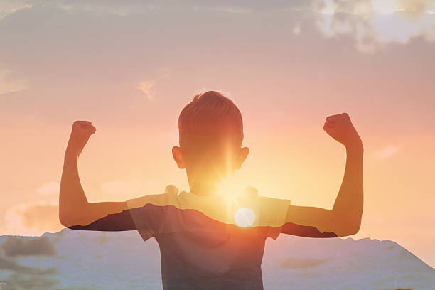 istock Strong healthy boy child flexing arms, winning concept. 2204944059