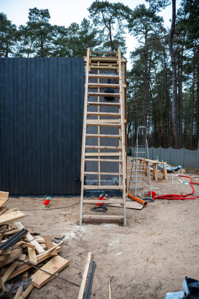 istock Construction Site with Wooden Ladder and Ventilation Pipes in Forest 2204944940