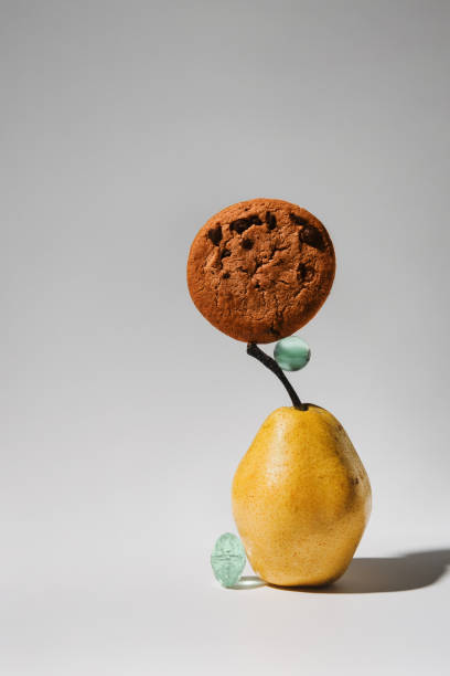 istock Still life with pear and oatmeal cookies 2204949033
