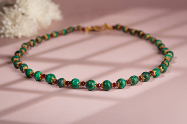 istock Malachite necklace photographed on a pink background 2204949168