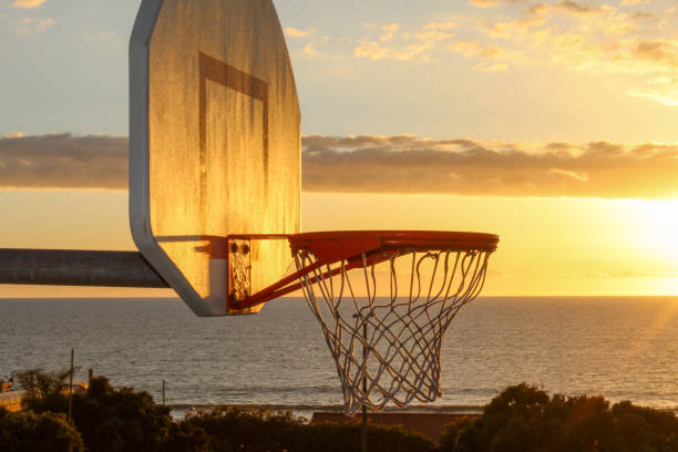 istock Basketball Hoop at Sunset 2204954026