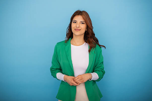 istock Young businesswoman smiling confidently on a blue background 2204960300