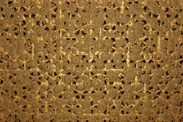 istock Golden spheres arranged in an intricate, abstract pattern, creating a luxurious and complex textured background 2204964576
