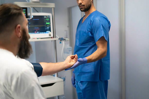 istock Doctor checking patient's pulse in hospital room 2204964841
