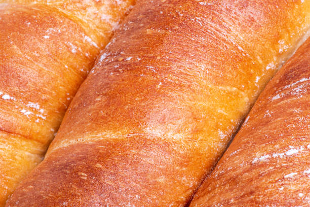Wheat baguette as a background macro photo