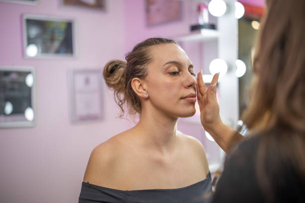 istock Skincare routine in the make up salon before professional make up artist applying professional make up to a client. 2204966437
