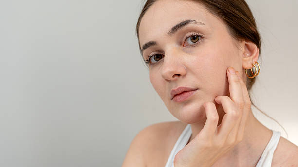 istock woman using skin care  products 2204972050