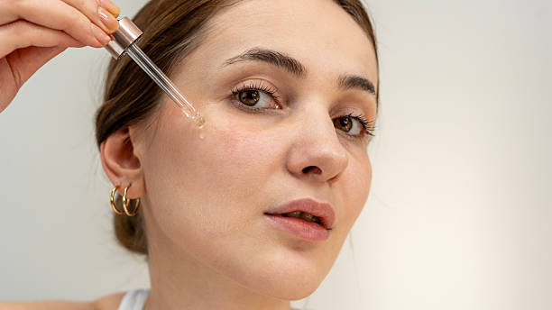 istock woman using skin care  products 2204972071