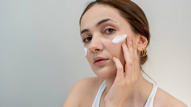 istock woman using skin care  products 2204972075
