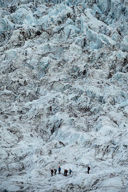 istock Huge ice mountains with people climbing on. 2204975270