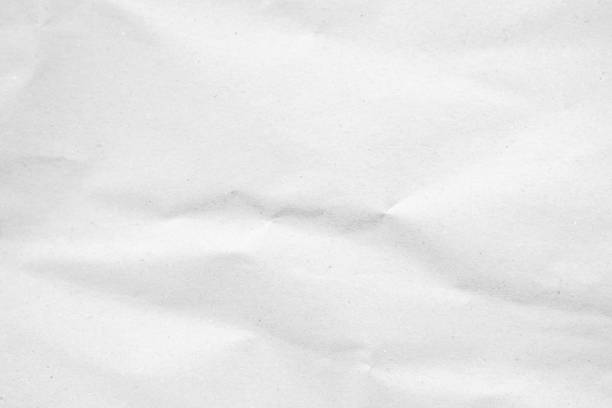 istock White recycled craft paper texture as background. Grey paper texture, Old vintage page or grunge vignette of old newspaper. Pattern rough art creased grunge letter. Hardboard with copy space for text. 2204976246