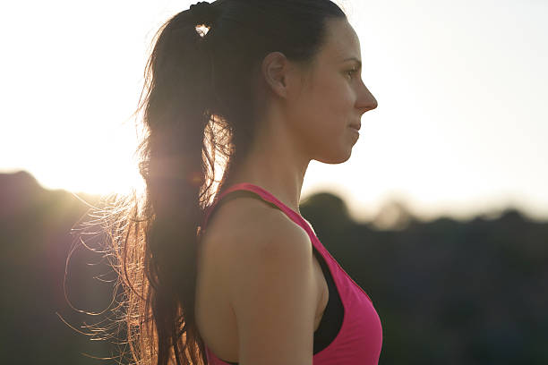 istock Woman practicing mindfulness during sunrise in outdoor setting, focusing on self-awareness and nature connection 2204977445
