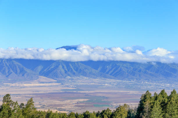 Clouds hanging over the mountains on a refreshing morning in Maui, Hawaii