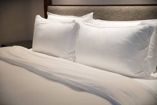 istock Comfortable bed in the modern hotel. 2204983535