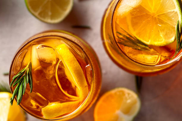 istock Refreshing hard seltzer with lemon, lime and ice garnished with rosemary twigs. 2204986905