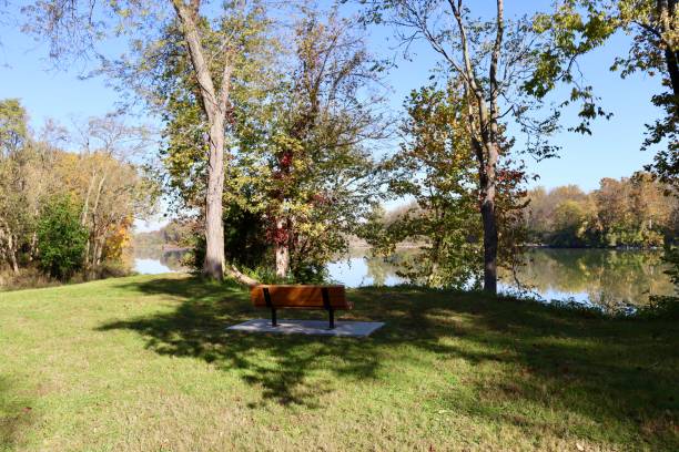 istock Park Bench on a Autumn Day 2204987229