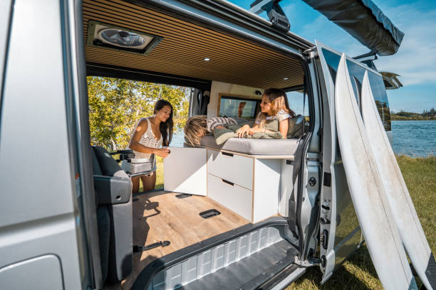 istock Mother and Children Setting Up Minivan for Camping Outdoors 2204989432