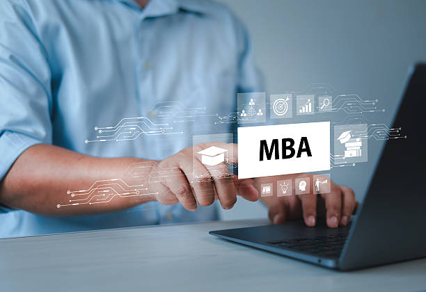 istock Businessman taps MBA icon on virtual screen. Business and Management Skills Development Course. Master of Business Administration (MBA) Program Concept. 2204991339