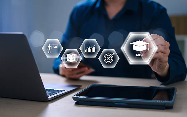 istock Businessman with virtual MBA icon for developing business and management skills. Master of Business Administration (MBA) program concept. 2204991352
