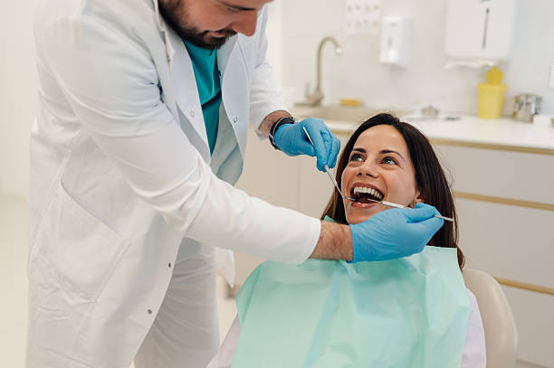 istock Dentist examining patient's teeth in modern dental clinic 2204991439