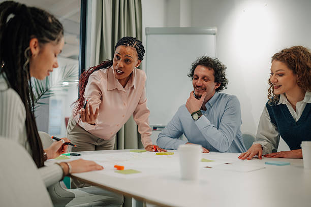 istock Diverse business team collaborating on project in modern office 2204991565