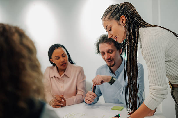 istock Young business people working together on a new project 2204991658