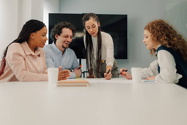 istock Diverse business team collaborating on project in modern office 2204991686