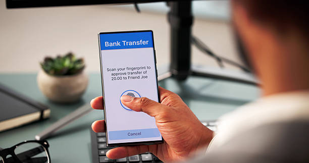 istock Secure Online Banking: African-American Man Making Secure Mobile Money 2204992178