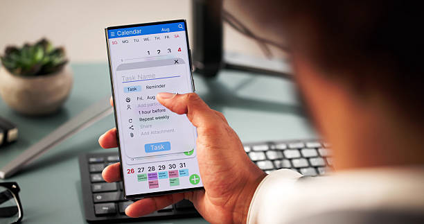 istock Young African American man organizing schedule on laptop 2204992209