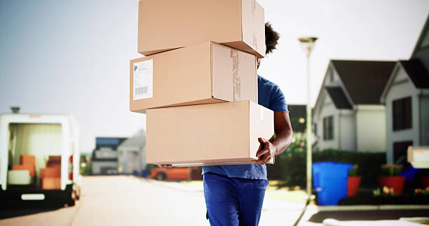 African American delivery man dropping packages